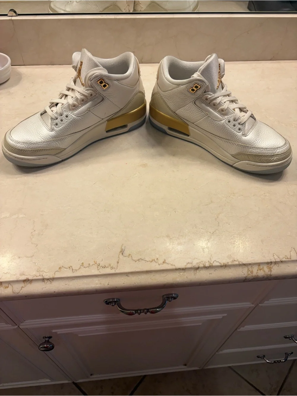 Nike White Sneakers with Metallic Gold Accents